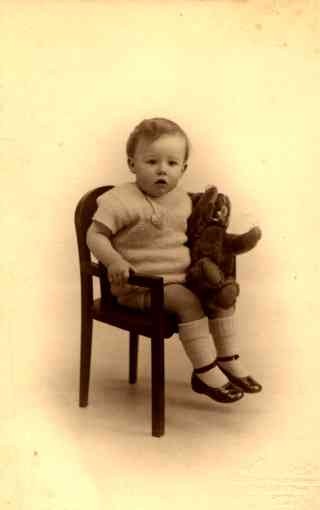 Boy Holding Teddy Bear in Chair RP