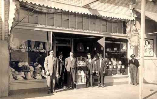 Salesmen by Clothes Storefront Real Photo