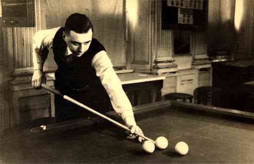 Player Holding Billiard Cue by Balls Real Photo