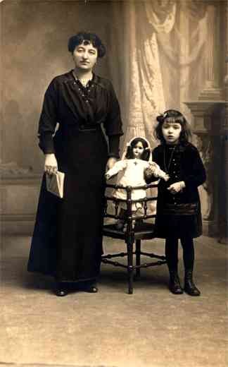 Girl Holding Red Cross Doll Real Photo