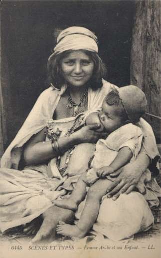 Young Arab Mother Nursing Baby Son