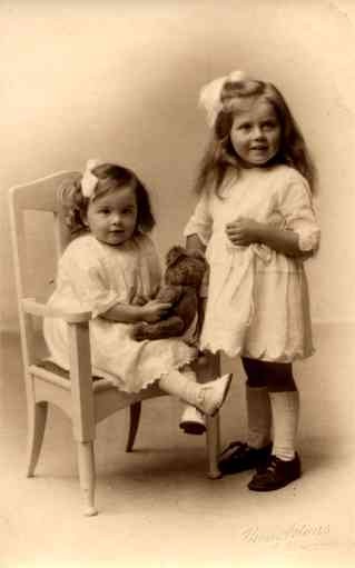 Girl in Chair Holding Teddy Bear Real Photo