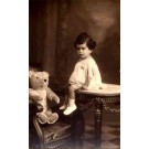 Teddy Bear in Arm Chair Girl on Table Real Photo